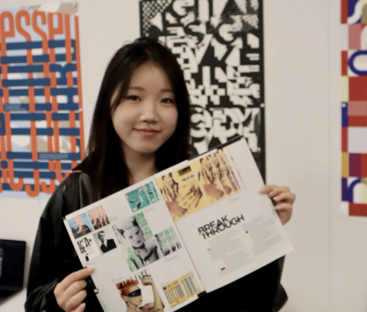 Holding the printed booklet